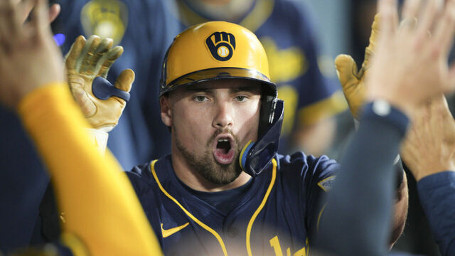 LOS ANGELES, CA - JULY 18: Caleb Durbin #21 of the Milwaukee Brewers celebrates in the dugout during the game between the Milwaukee Brewers and the Los Angeles Dodgers at Dodger Stadium on Friday, July 18, 2025 in Los Angeles, California.