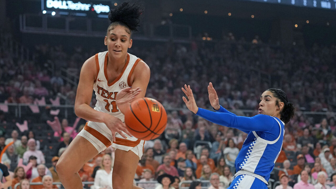 AUSTIN, TEXAS - FEBRUARY 9: Justice Carlton #11 of the Texas Longhorns attempts to save the ball from going out of bounds ahead of Asia Boone #8 of the Kentucky Wildcats during the first half at Moody Center on February 9, 2026 in Austin, Texas.