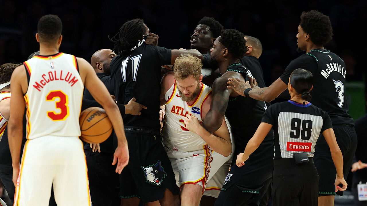 MINNEAPOLIS, MINNESOTA - FEBRUARY 09: Naz Reid #11 of the Minnesota Timberwolves and Mouhamed Gueye #18 of the Atlanta Hawks get into a scrum in the fourth quarter at Target Center on February 09, 2026 in Minneapolis, Minnesota. Reid and Gueye were ejected from the game.