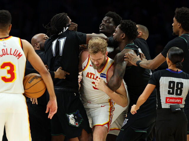 MINNEAPOLIS, MINNESOTA - FEBRUARY 09: Naz Reid #11 of the Minnesota Timberwolves and Mouhamed Gueye #18 of the Atlanta Hawks get into a scrum in the fourth quarter at Target Center on February 09, 2026 in Minneapolis, Minnesota. Reid and Gueye were ejected from the game.