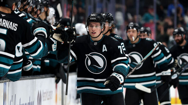 SAN JOSE, CALIFORNIA - NOVEMBER 18: Macklin Celebrini #71 of the San Jose Sharks is congratulated by teammates after he scored his first goal against the Utah Mammoth in the first period at SAP Center on November 18, 2025 in San Jose, California.