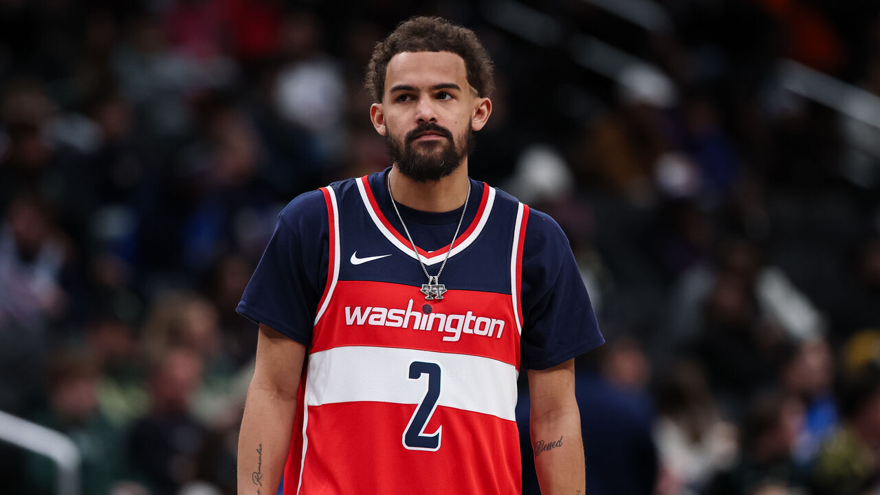 WASHINGTON, DC - JANUARY 29: Trae Young #3 of the Washington Wizards looks on while wearing a John Wall jersey during the second half against the Milwaukee Bucks at Capital One Arena on January 29, 2026 in Washington, DC.