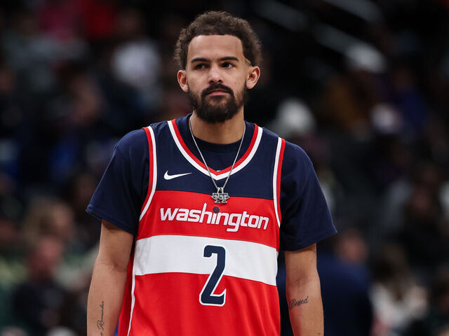 WASHINGTON, DC - JANUARY 29: Trae Young #3 of the Washington Wizards looks on while wearing a John Wall jersey during the second half against the Milwaukee Bucks at Capital One Arena on January 29, 2026 in Washington, DC.