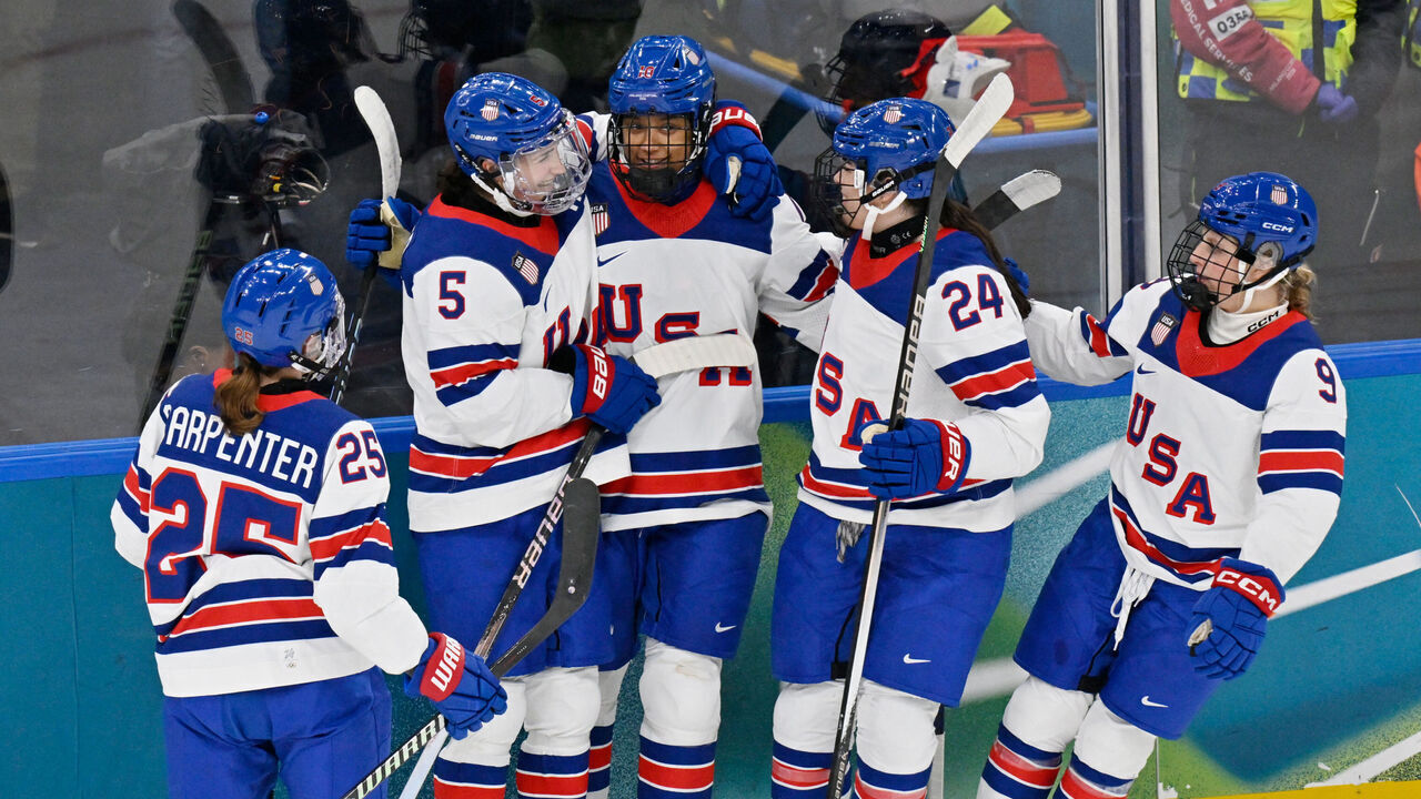 USA's players celebrate a team goal during the women's preliminary round Group A Ice Hockey match between Canada and USA at the Milano Santagiulia Ice Hockey Arena during the Milano Cortina 2026 Winter Olympic Games in Milan, on February 10, 2026.