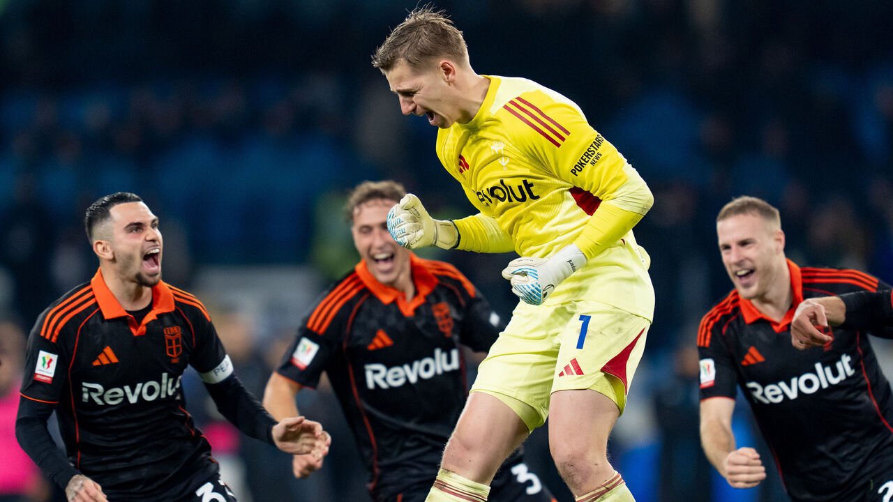 Jean Butez of Como 1907 celebrates with his teammates after making the decisive save in the penalty shootout at the end of the Coppa Italia 2025/26 Quarter Final match between SSC Napoli and Como 1907 at Stadio Diego Armando Maradona on Febraury 10, 2026 in Naples, Italy.