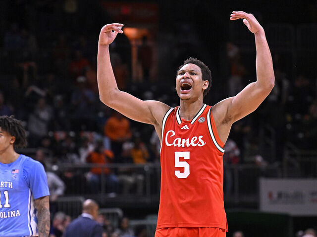 CORAL GABLES, FL - FEBRUARY 10: Miami forward Malik Reneau (5) fires up the crowd late in the second half (also pictured, North Carolina guard Jonathan Powell (11)) as the Miami Hurricanes faced the North Carolina Tar Heels on February 10, 2026, at the Watsco Center in Coral Gables, Florida.