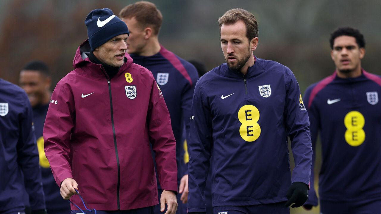 ENFIELD, ENGLAND - NOVEMBER 15: Thomas Tuchel, Head Coach of England, talks to Harry Kane of England during a training session at Tottenham Hotspur Training Centre on November 15, 2025 in Enfield, England.