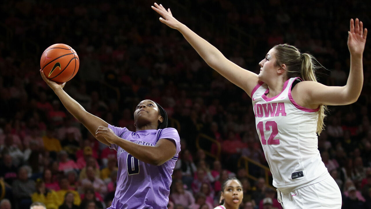 IOWA CITY, IA - FEBRUARY 11: Guard Sayvia Sellers #0 of the Washington Huskies goes to the basket in the first half against center Layla Hayes #12 of the Iowa Hawkeyes on February 11, 2026 at Carver-Hawkeye Arena, in Iowa City, Iowa.