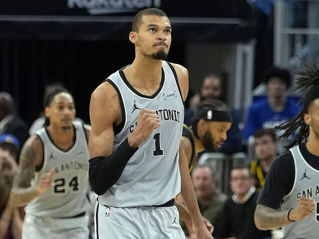 SAN FRANCISCO, CALIFORNIA - FEBRUARY 11: Victor Wembanyama #1 of the San Antonio Spurs reacts after making a three-point shot against the Golden State Warriors in the second half at Chase Center on February 11, 2026 in San Francisco, California.