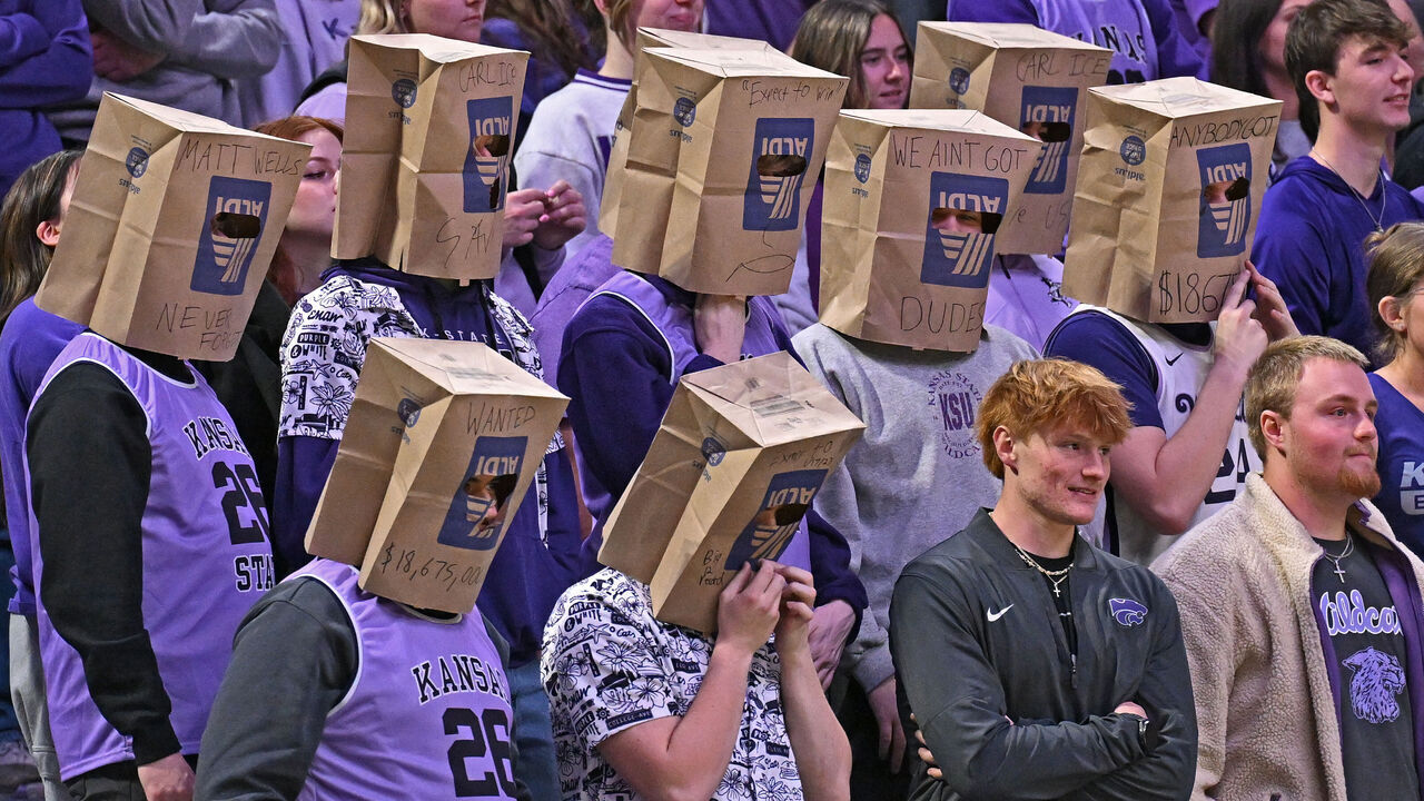 MANHATTAN, KANSAS - FEBRUARY 11: Kansas State Wildcats fans wear paper bags over their heads during a game against the Cincinnati Bearcats at Bramlage Coliseum on February 11, 2026 in Manhattan, Kansas.