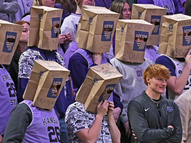 MANHATTAN, KANSAS - FEBRUARY 11: Kansas State Wildcats fans wear paper bags over their heads during a game against the Cincinnati Bearcats at Bramlage Coliseum on February 11, 2026 in Manhattan, Kansas.
