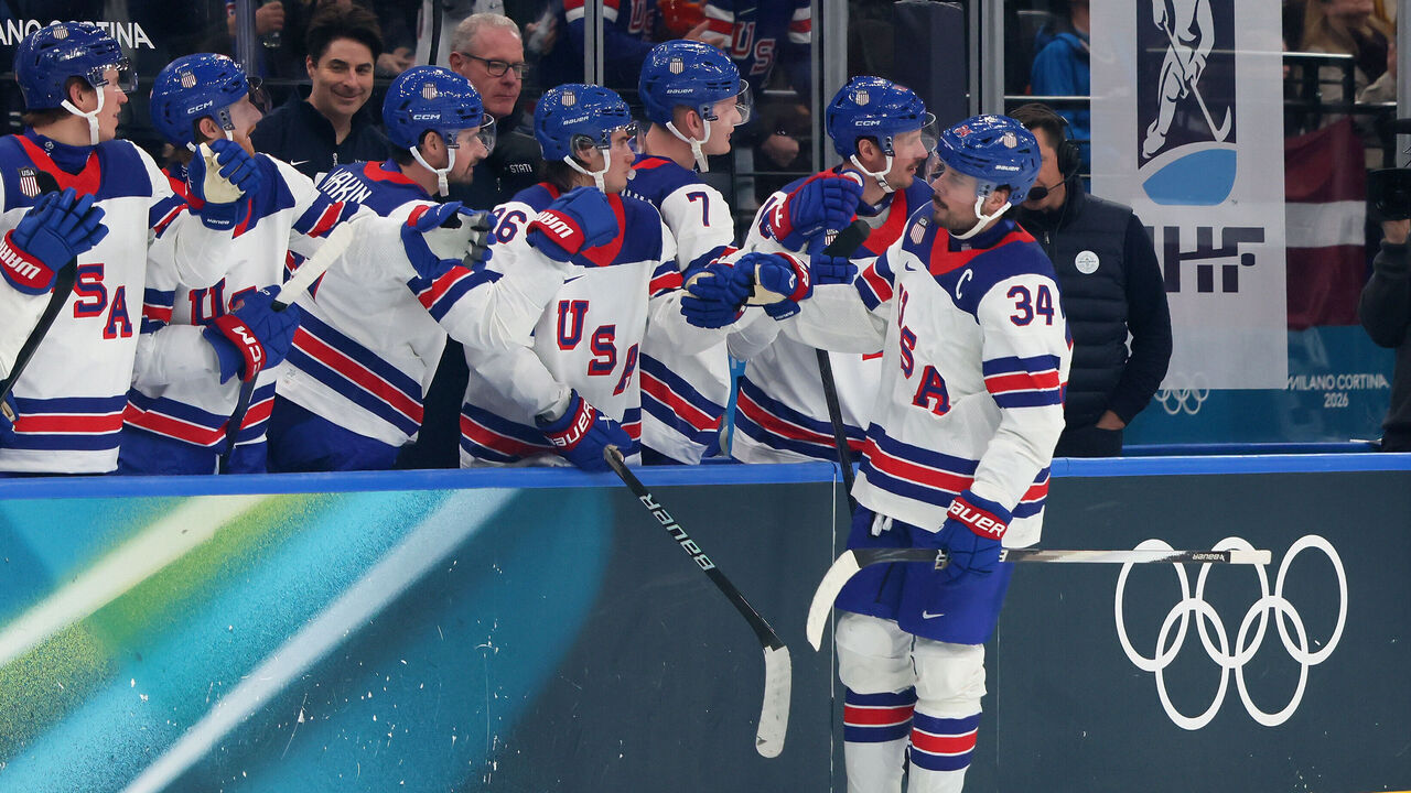 MILAN, ITALY - FEBRUARY 12: Auston Matthews #34 of Team United States celebrates with teammates after scoring a goal in the third period during the Men's Preliminary Group C match between Latvia and United States on day six of the Milano Cortina 2026 Winter Olympic games at Milano Santagiulia Ice Hockey Arena on February 12, 2026 in Milan, Italy.
