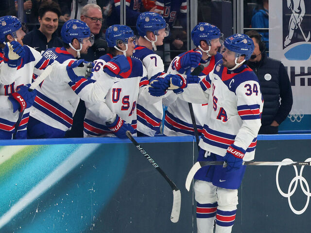 MILAN, ITALY - FEBRUARY 12: Auston Matthews #34 of Team United States celebrates with teammates after scoring a goal in the third period during the Men's Preliminary Group C match between Latvia and United States on day six of the Milano Cortina 2026 Winter Olympic games at Milano Santagiulia Ice Hockey Arena on February 12, 2026 in Milan, Italy.