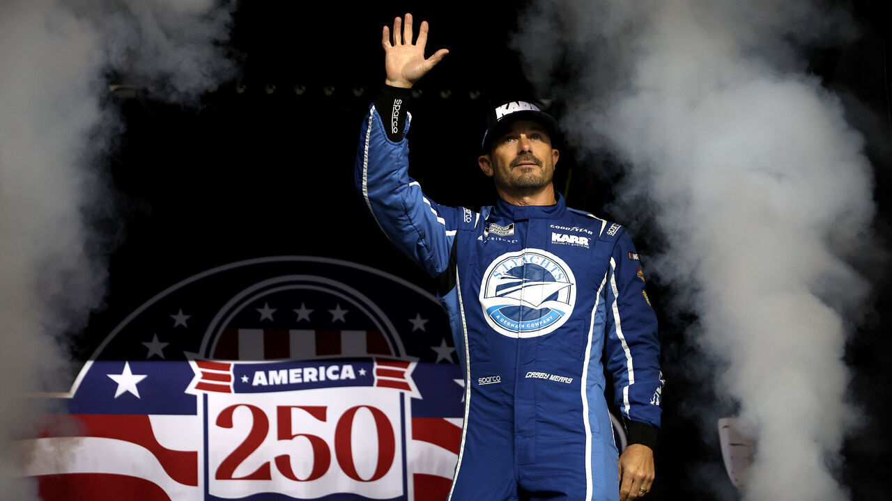 DAYTONA BEACH, FLORIDA - FEBRUARY 12: Casey Mears, driver of the #66 SI Yachts/Gracie Foundation Ford, waves to fans as he walks onstage during driver intros prior to Duel 1 for the NASCAR Cup Series Daytona 500 at Daytona at Daytona International Speedway on February 12, 2026 in Daytona Beach, Florida.
