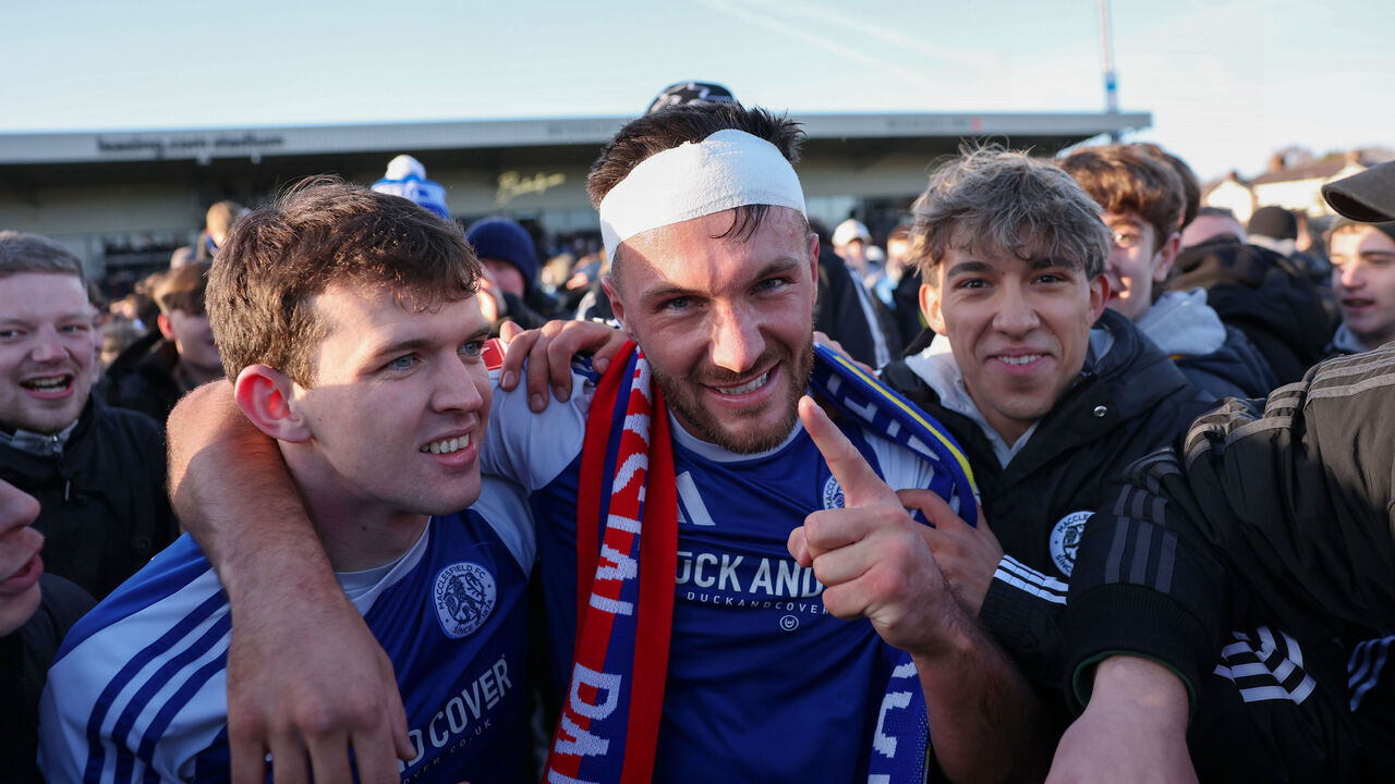 MACCLESFIELD, ENGLAND - JANUARY 10: Paul Dawson of Macclesfield celebrates with team mate Luke Duffy and fans after the team's victory following the Emirates FA Cup Third Round match between Macclesfield and Crystal Palace at Moss Rose Ground on January 10, 2026 in Macclesfield, England.