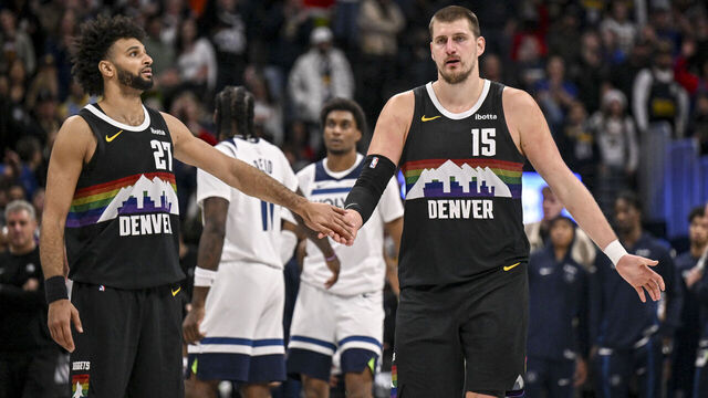 DENVER , CO - DECEMBER 26: Nikola Jokic (15) and Jamal Murray (27) of the Denver Nuggets shake hands during overtime of the Nuggets' 142-138 win over the Minnesota Timberwolves at Ball Arena in Denver, Colorado on Thursday, December 25, 2025.