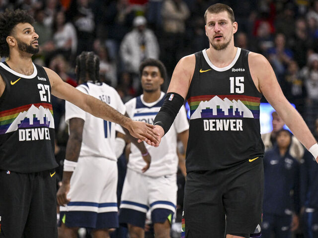 DENVER , CO - DECEMBER 26: Nikola Jokic (15) and Jamal Murray (27) of the Denver Nuggets shake hands during overtime of the Nuggets' 142-138 win over the Minnesota Timberwolves at Ball Arena in Denver, Colorado on Thursday, December 25, 2025.