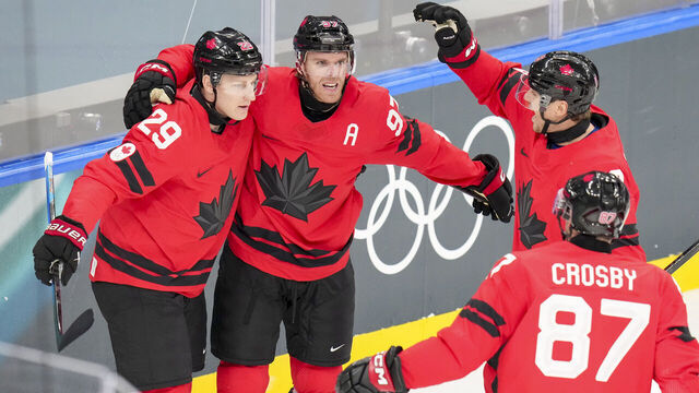 Milan, Italy - February 13: Connor McDavid of Canada celebrates after scoring his team's first goal with teammates during the Ice Hockey - Preliminary Round - Group A match between Canada and Switzerland at Milano Santagiulia Ice Hockey Arena on February 13, 2026 in Milan, Italy.