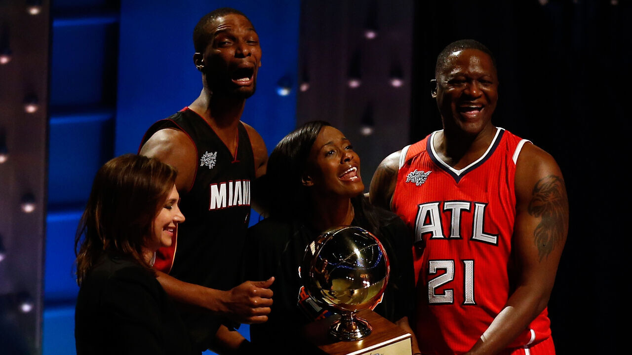 NEW YORK, NY - FEBRUARY 14: Chris Bosh #1 of the Miami Heat and the Eastern Conference celebrates with NBA Legend Dominique Wilkins and Swin Cash #32 of the New York Liberty after winning the Degree Shooting Stars Competition as part of the 2015 NBA Allstar Weekend at Barclays Center on February 14, 2015 in the Brooklyn borough of New York City.