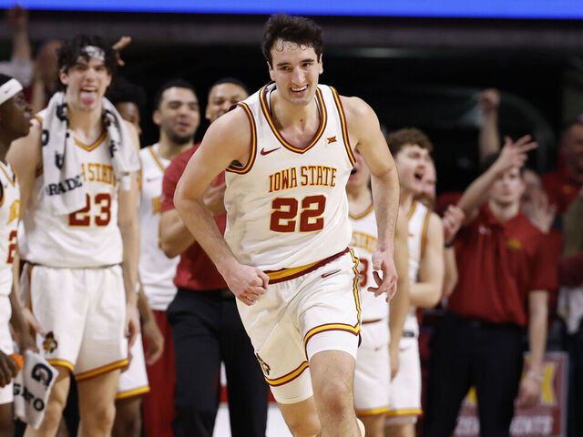 AMES, IOWA - FEBRUARY 14: Milan Momcilovic #22 of the Iowa State Cyclones reacts after scoring a three-point basket in the first half of play against the Kansas Jayhawks at Hilton Coliseum on February 14, 2026 in Ames, Iowa. Iowa State won 74-56.