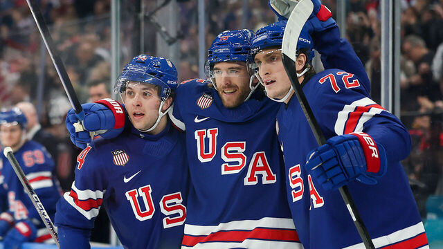 MILAN, ITALY - FEBRUARY 14: Noah Hanifin #15 of Team United States celebrates after scoring a goal with Tage Thompson #72 and Brock Faber #14 in the second period during the Men's Preliminary Group C match between the United States and Denmark on day eight of the Milano Cortina 2026 Winter Olympic games at Milano Santagiulia Ice Hockey Arena on February 14, 2026 in Milan, Italy.