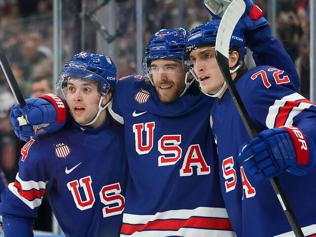 MILAN, ITALY - FEBRUARY 14: Noah Hanifin #15 of Team United States celebrates after scoring a goal with Tage Thompson #72 and Brock Faber #14 in the second period during the Men's Preliminary Group C match between the United States and Denmark on day eight of the Milano Cortina 2026 Winter Olympic games at Milano Santagiulia Ice Hockey Arena on February 14, 2026 in Milan, Italy.