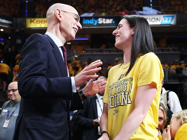 INDIANAPOLIS, INDIANA - JUNE 11: NBA Commissioner Adam Silver and Caitlin Clark of the Indiana Fever speak during Game Three of the 2025 NBA Finals between the Indiana Pacers and the Oklahoma City Thunder at Gainbridge Fieldhouse on June 11, 2025 in Indianapolis, Indiana.