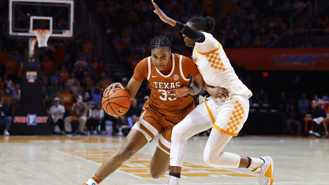 KNOXVILLE, TENNESSEE - FEBRUARY 15: Madison Booker #35 of the Texas Longhorns drives against Alyssa Latham #33 of the Tennessee Volunteers during the second half at Thompson-Boling Arena on February 15, 2026 in Knoxville, Tennessee.