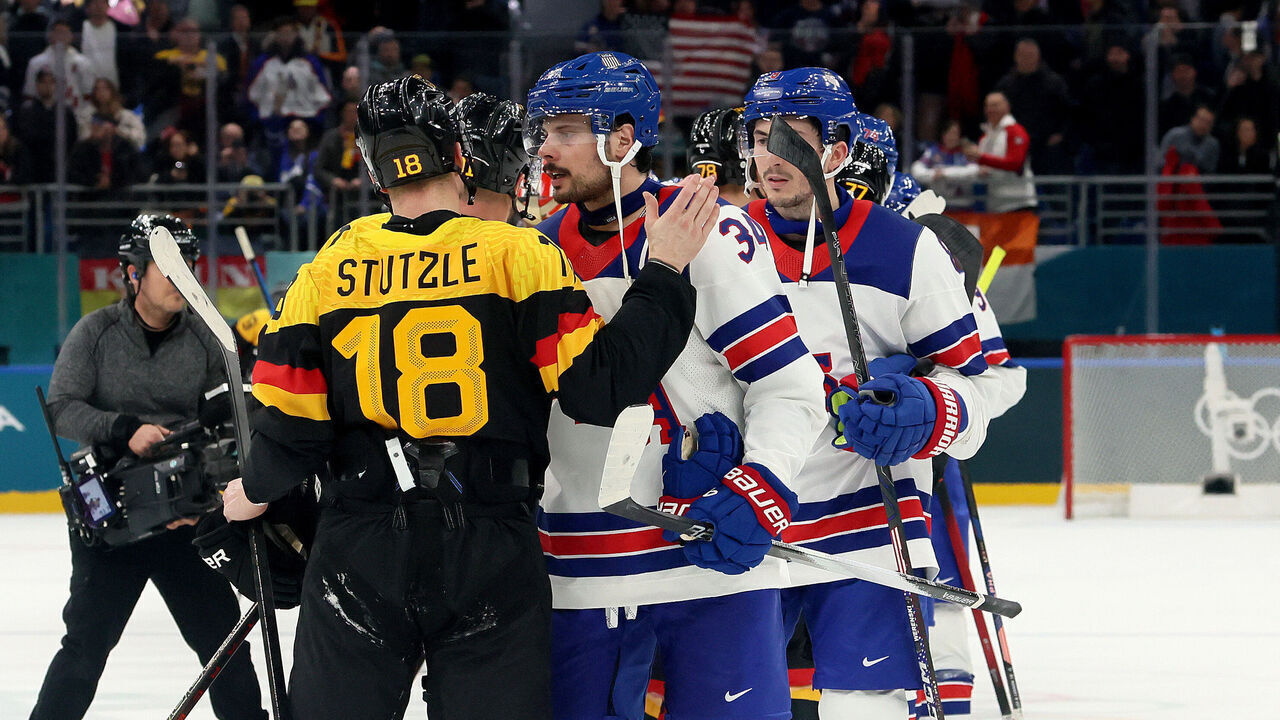MILAN, ITALY - FEBRUARY 15: Tim Stutzle #18 of Team Germany and Auston Matthews #34 of Team United States shake hands after the Men's Preliminary Group C match between the United States and Germany on day nine of the Milano Cortina 2026 Winter Olympic games at Milano Santagiulia Ice Hockey Arena on February 15, 2026 in Milan, Italy.