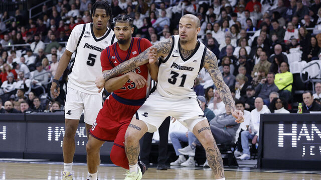 PROVIDENCE, RI - FEBRUARY 14: Duncan Powell #31 of the Providence Friars and Bryce Hopkins #23 of the St. John's Red Storm in action during the college basketball game between St John's Red Storm and Providence Friars on February 14, 2026, at Amica Mutual Pavilion in Providence, RI.