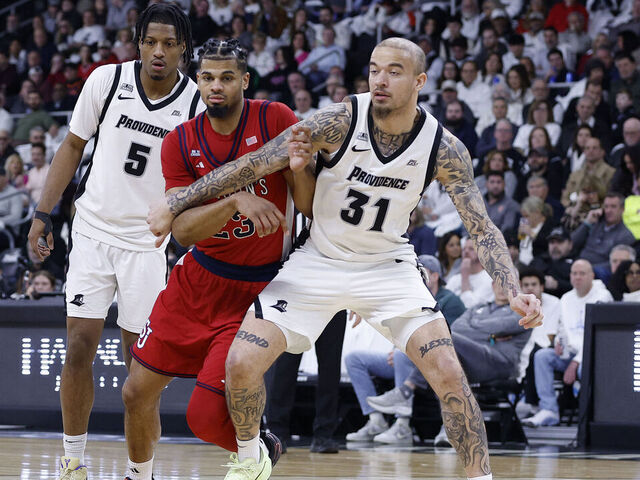 PROVIDENCE, RI - FEBRUARY 14: Duncan Powell #31 of the Providence Friars and Bryce Hopkins #23 of the St. John's Red Storm in action during the college basketball game between St John's Red Storm and Providence Friars on February 14, 2026, at Amica Mutual Pavilion in Providence, RI.