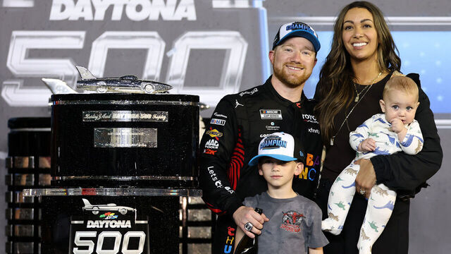 DAYTONA BEACH, FLORIDA - FEBRUARY 15: Tyler Reddick, driver of the #45 Chumba Casino Toyota, wife, Alexa De Leon and sons, Beau Reddick and Rookie George Reddick celebrate in victory lane after winning the NASCAR Cup Series Daytona 500 at Daytona International Speedway on February 15, 2026 in Daytona Beach, Florida.
