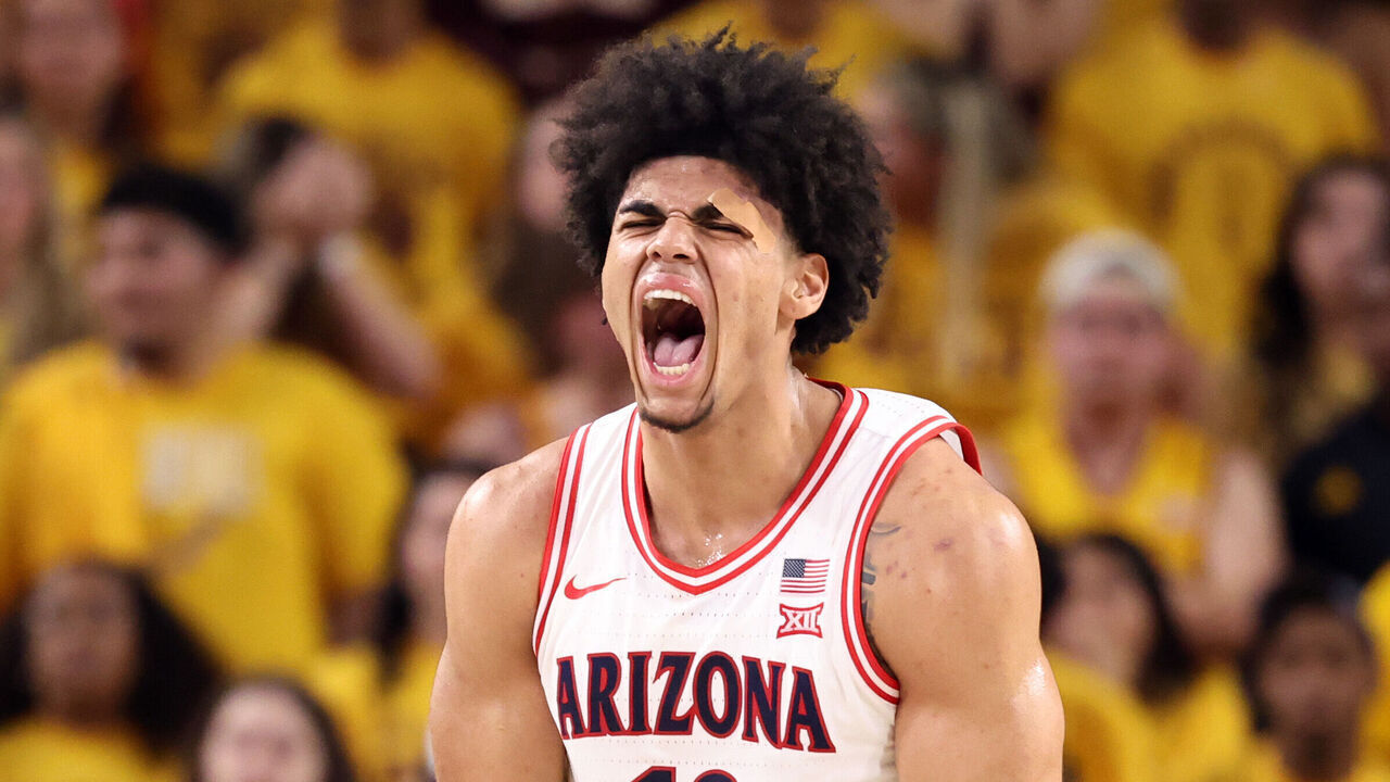 TEMPE, ARIZONA - JANUARY 31: Koa Peat #10 of the Arizona Wildcats reacts after dunking the ball against the Arizona State Sun Devils in the second half at Desert Financial Arena on January 31, 2026 in Tempe, Arizona. The Wildcats defeated the Sun Devils 87-74.