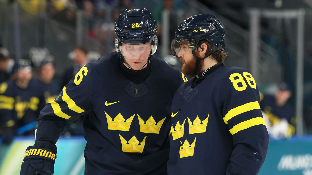 MILAN, ITALY - FEBRUARY 14: Rasmus Dahlin #26 and William Nylander #88 of Team Sweden talk in the third period during the Men's Preliminary Group B match between Sweden and Slovakia on day eight of the Milano Cortina 2026 Winter Olympic games at Milano Santagiulia Ice Hockey Arena on February 14, 2026 in Milan, Italy.