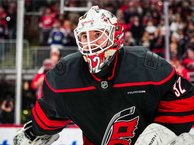 RALEIGH, NORTH CAROLINA - FEBRUARY 03: Brandon Bussi #32 of the Carolina Hurricanes reacts after a 4-3 victory against the Ottawa Senators at Lenovo Center on February 03, 2026 in Raleigh, North Carolina.
