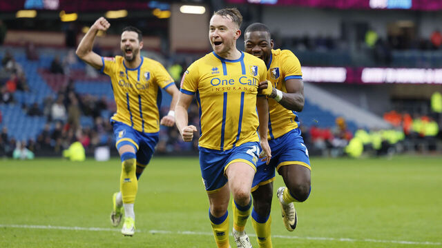 Mansfield Town's Louis Reed celebrates scoring their side's second goal of the game during the Emirates FA Cup fourth round match at Turf Moor, Burnley. Picture date: Saturday February 14, 2026.