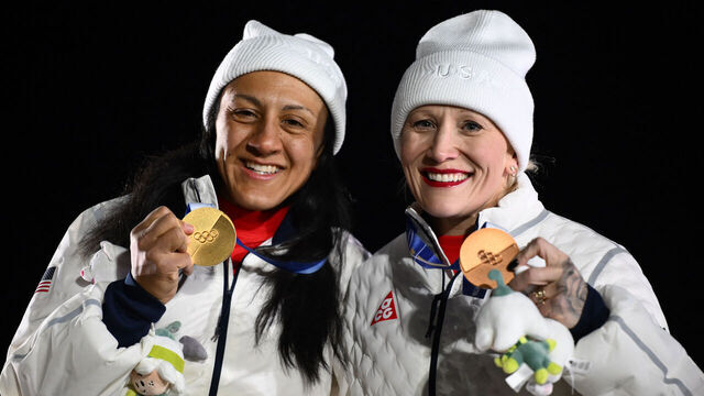 Gold medallist USA's Elana Meyers Taylor and bronze medallist USA's Kaillie Armbruster Humphries pose on the podium of the bobsleigh women's monobob at Cortina Sliding Centre during the Milano Cortina 2026 Winter Olympic Games in Cortina d'Ampezzo on February 16, 2026.