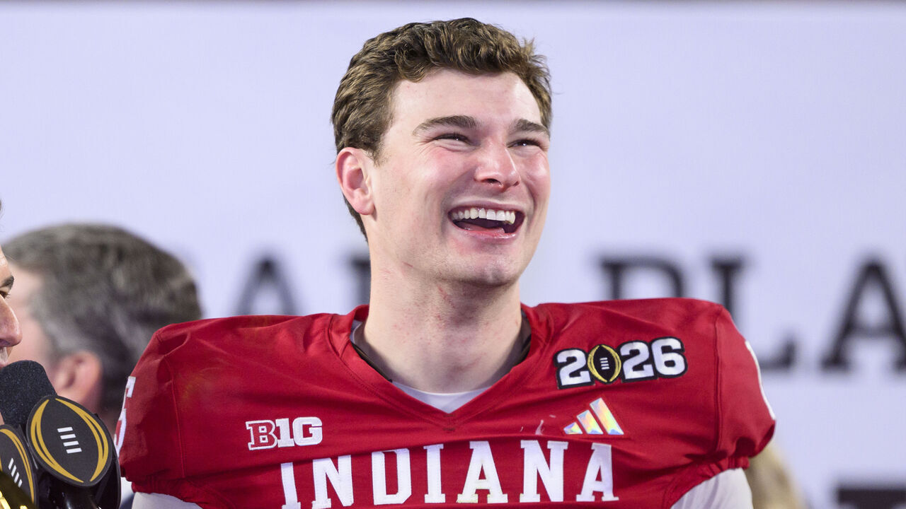 MIAMI GARDENS, FL - JANUARY 19: QB Fernando Mendoza #15 of the Indiana Hoosiers smiles on the trophy stage after the Indiana Hoosiers versus the Miami Hurricanes College Football Playoff National Championship Game Presented by AT&T on January 19, 2026, at Hard Rock Stadium in Miami Gardens, FL.