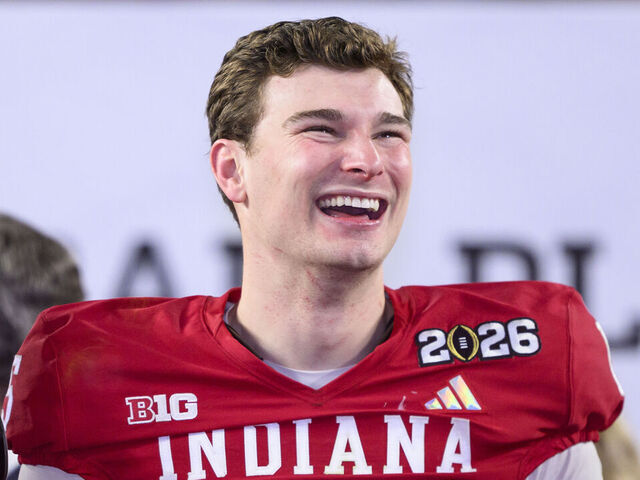 MIAMI GARDENS, FL - JANUARY 19: QB Fernando Mendoza #15 of the Indiana Hoosiers smiles on the trophy stage after the Indiana Hoosiers versus the Miami Hurricanes College Football Playoff National Championship Game Presented by AT&T on January 19, 2026, at Hard Rock Stadium in Miami Gardens, FL.