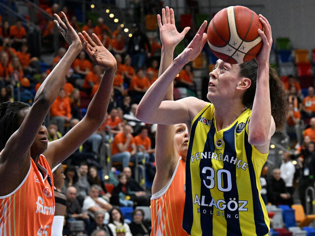 Schio's Spanish center Astou Ndour (L) tries to block Fenerbahce's US power forward Breanna Stewart (R) during the Euroleague basketball women semi-final match between Fenerbahce and Schio in Prague, Czech Republic, on April 14, 2023.
