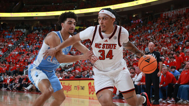 RALEIGH, NC - FEBRUARY 17: Darrion Williams #1 of the NC State Wolfpack drives past the defender during the college basketball game between the UNC Tar Heels and the NC State Wolfpack on February 17, 2026 at the Lenovo Center in Raleigh, N.C.