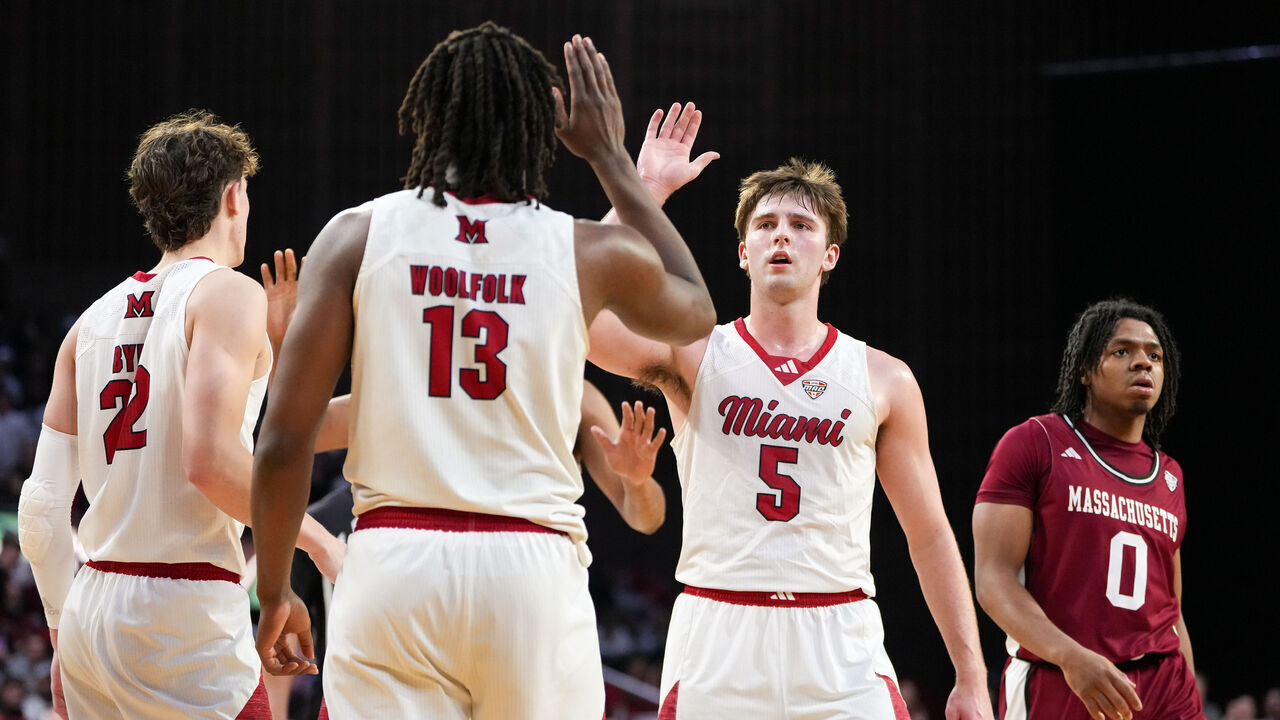 OXFORD, OHIO - JANUARY 27: Antwone Woolfolk #13 and Peter Suder #5 of the Miami (OH) RedHawks celebrate in the second half against the UMass Minutemen at Millett Hall on January 27, 2026 in Oxford, Ohio.