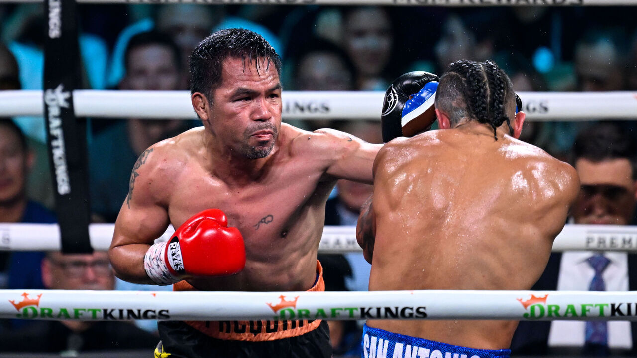 LAS VEGAS, NEVADA - JULY 19: Manny Pacquiao (in black short) and Mario Barrios (in blue short) exchange punches during their WBC welterweight championship world titles of the Premiere Boxing Championship on Saturday night at MGM Grand Garden Arena in Las Vegas, Nevada, United States on July 19, 2025.
