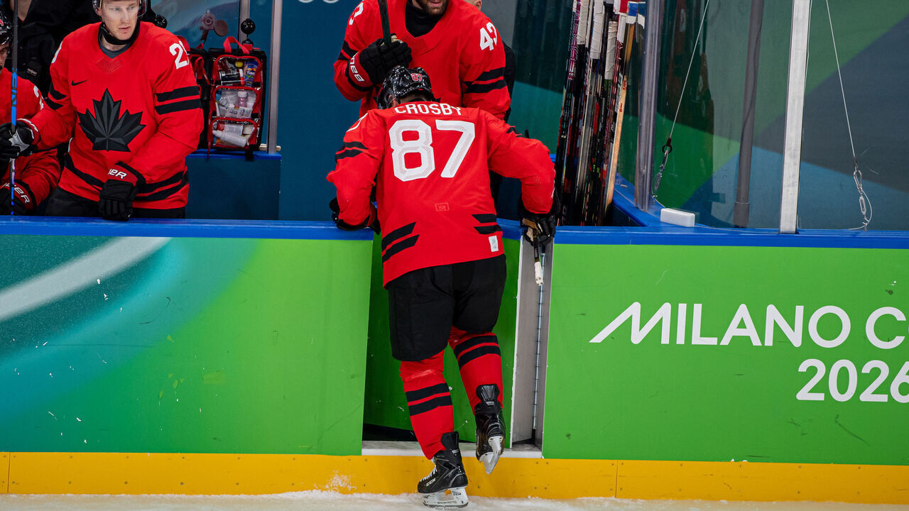MILAN, ITALY - FEBRUARY 18: Sidney Crosby #87 of Canada gets to the Bech slowly after clash with Radko Gudas #3 of Czechia during the Men's Playoffs Quarterfinal match between Canada and Czechia on day twelve of the Milano Cortina 2026 Winter Olympic games at Milano Santagiulia Ice Hockey Arena on February 18, 2026 in Milan, Italy.