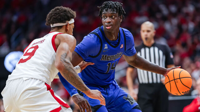 LOUISVILLE, KENTUCKY - DECEMBER 13: Hasan Abdul Hakim #14 of the Memphis Tigers dribbles against Khani Rooths #9 of the Louisville Cardinals during the game against the Louisville Cardinals at KFC YUM! Center on December 13, 2025 in Louisville, Kentucky.