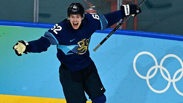 Finland's #62 Artturi Lehkonen (C) celebrates with teammate Finland's #15 Anton Lundell after scoring his team's third goal in overtime during the men's play-off quarter-final ice hockey match between Finland and Switzerland at the Milano Rho Ice Hockey Arena during the Milano Cortina 2026 Winter Olympic Games in Milan, on February 18, 2026.