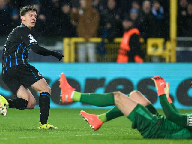 Club Brugge's Greek forward #08 Christos Tzolis (L) scores his team's third goal during the UEFA Champions League knockout round play-off first leg football match between Club Brugge and Atletico Madrid at the Jan Breydel Stadium in Brugge on February 18, 2026.