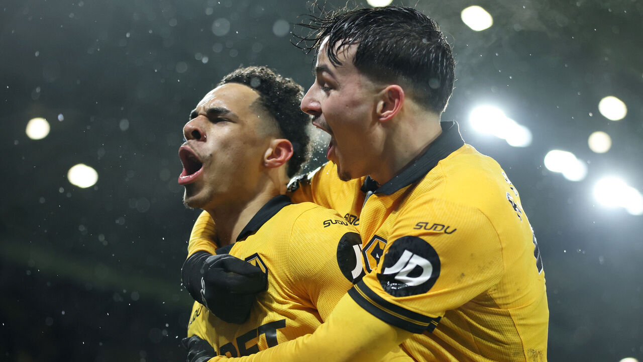 WOLVERHAMPTON, ENGLAND - FEBRUARY 18: Tom Edozie of Wolverhampton Wanderers celebrates scoring his team's second goal with teammates during the Premier League match between Wolverhampton Wanderers and Arsenal at Molineux on February 18, 2026 in Wolverhampton, England.
