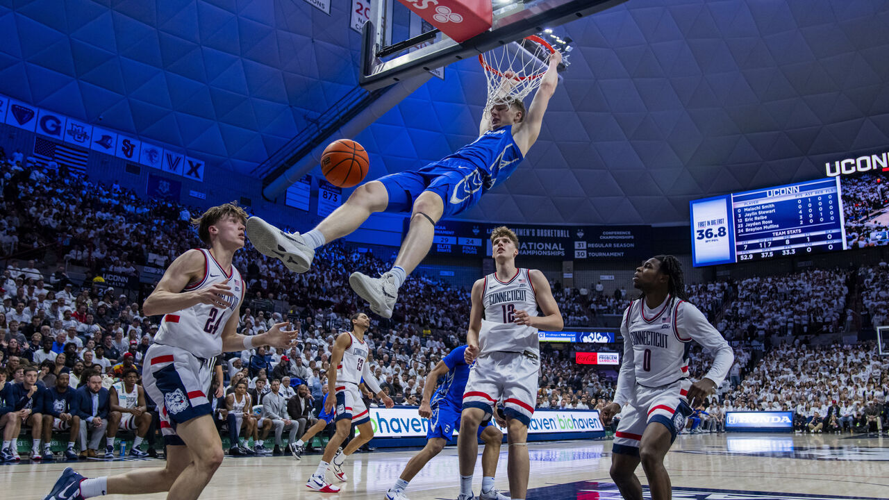 STORRS, CONNECTICUT - FEBRUARY 18: Josh Dix #4 of the Creighton Bluejays gets the dunk against the Connecticut Huskies during the first half of an NCAA men's basketball game at Harry A. Gampel Pavilion on February 18, 2026 in Storrs, Connecticut.