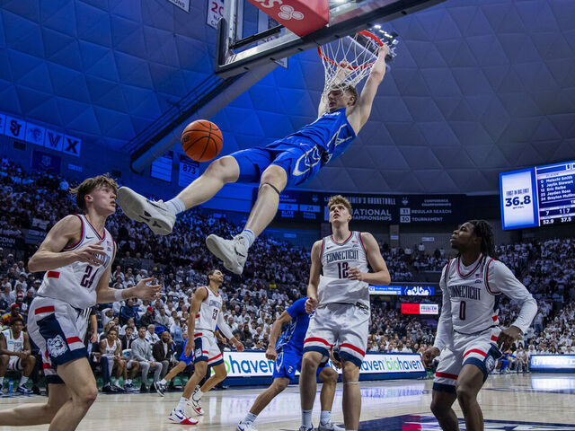 STORRS, CONNECTICUT - FEBRUARY 18: Josh Dix #4 of the Creighton Bluejays gets the dunk against the Connecticut Huskies during the first half of an NCAA men's basketball game at Harry A. Gampel Pavilion on February 18, 2026 in Storrs, Connecticut.